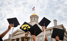 Graduates with their caps in the air